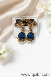 Beautiful peacock design earrings with blue stone & pearl drops.