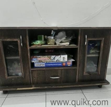Elegant wooden cabinet available with good storage space.