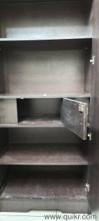 Double door wooden cupboard with mirror in good condition