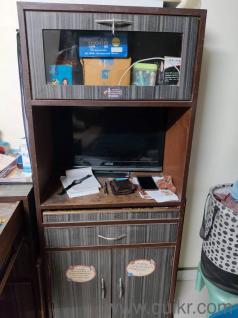Desktop computer with cupboard for storage 