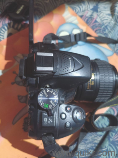 nikon camera and lens and battery and charger with bag 