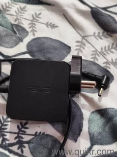 Original ASUS laptop AC power adapter charger (Model: ADP-45BWA). Output: 19V 2.37A (45W). Fully functional and in good condition.