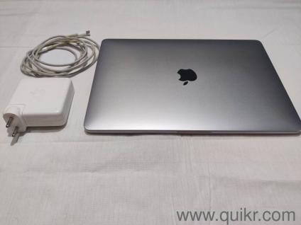 MacBook Pro 13-inch, 2020, Four Thunderbolt 3 ports with Touch bar.